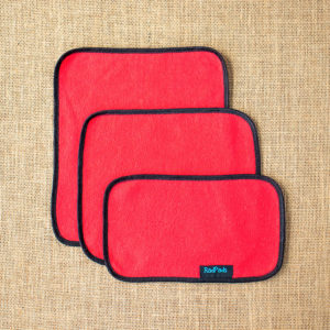 3 unfolded red hemp fleece towel inserts showing sizes Light, Medium and Heavy